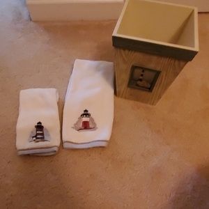 Decorative towels and waste basket for bathroom
